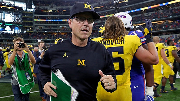 Jim Harbaugh and Chase Winovich (15)