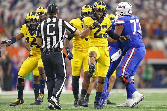 Josh Metellus (14) and Tyree Kinnel (23)