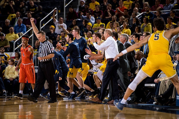 John Beilein, D.J. Wilson (5), and Michigan Team