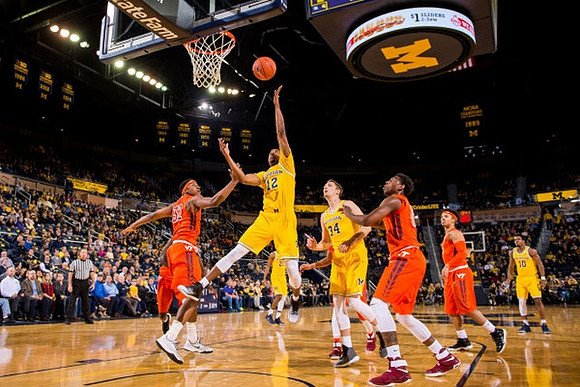 Muhammad-Ali Abdur-Rahkman (12), Mark Donnal (34), and Derrick Walton Jr. (10)