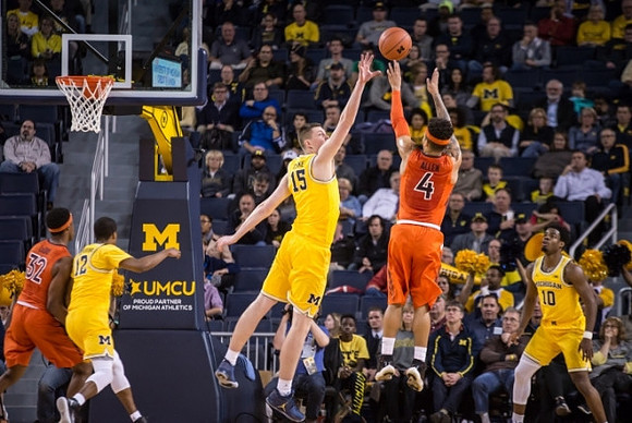 Muhammad-Ali Abdur-Rahkman (12), Jon Teske (15), and Derrick Walton Jr. (10)