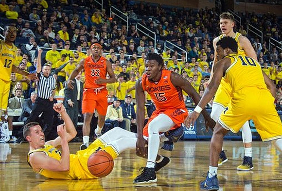 Muhammad-Ali Abdur-Rahkman (12), Duncan Robinson (22), Derrick Walton Jr. (10), and Moritz Wagner (13)