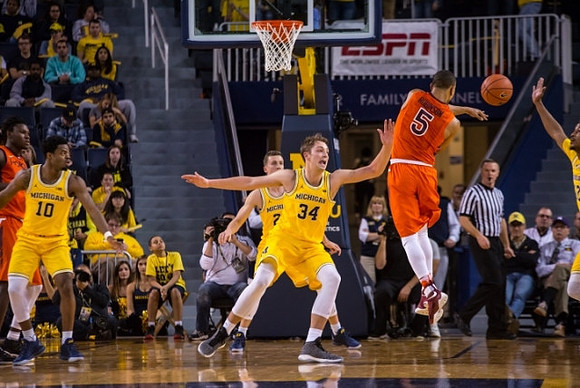 Derrick Walton Jr. (10), Duncan Robinson (22), and Mark Donnal (34)