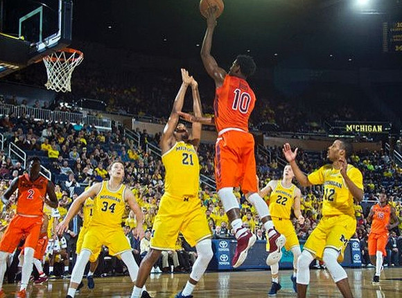 Mark Donnal (34), Zak Irvin (21), Duncan Robinson (22), and Muhammad-Ali Abdur-Rahkman (12)
