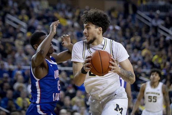 Brandon Johns Jr. (23) and Eli Brooks (55)