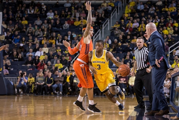 Xavier Simpson (3) and Virginia Tech Head Coach Buzz Williams