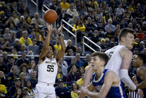 Eli Brooks (55) and Jon Teske (15)