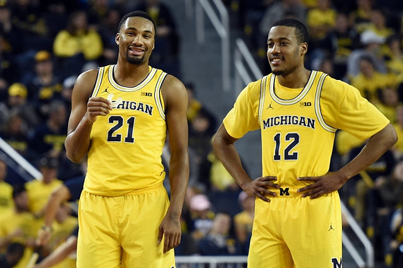 Zak Irvin (21) and Muhammad-Ali Abdur-Rahkman (12)