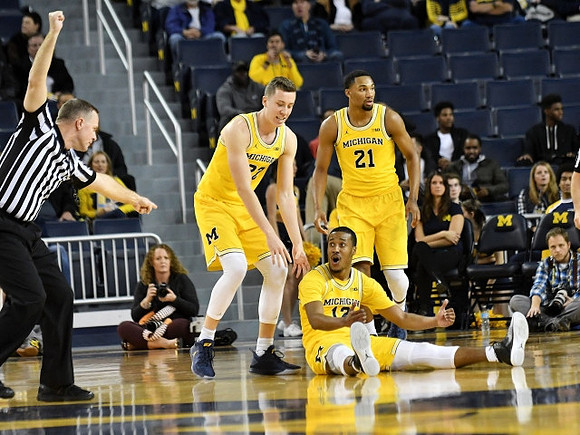 Duncan Robinson (22), Muhammad-Ali Abdur-Rahkman (12), and Zak Irvin (21)