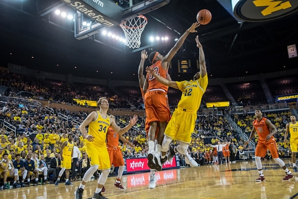Derrick Walton Jr. (10), Mark Donnal (34), Muhammad-Ali Abdur-Rahkman (12), and Zak Irvin (21)