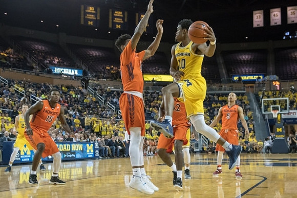 Duncan Robinson (22) and Derrick Walton Jr. (10)