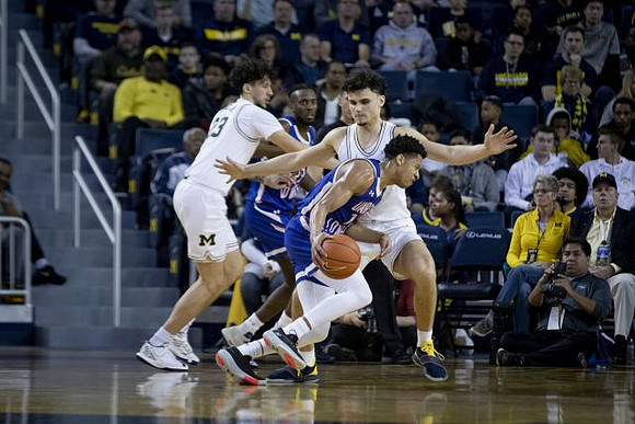 Brandon Johns Jr. (23) and Adrien Nunez (5)