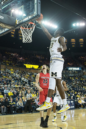 Zak Irvin (21) and Caris LeVert (23)