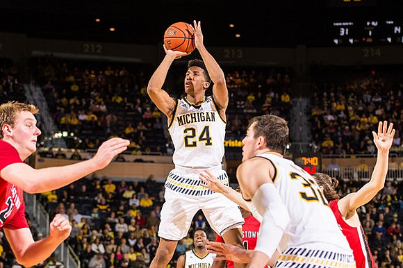 Aubrey Dawkins (24), Derrick Walton Jr. (10), and Ricky Doyle (32)