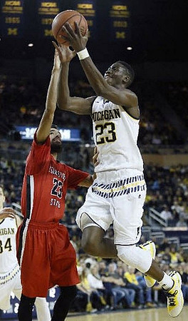 Mark Donnal (34) and Caris LeVert (23)