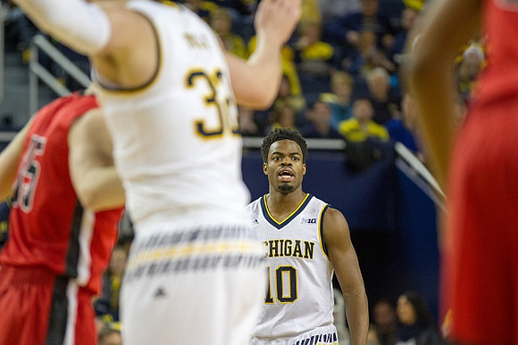Ricky Doyle (32) and Derrick Walton Jr. (10)