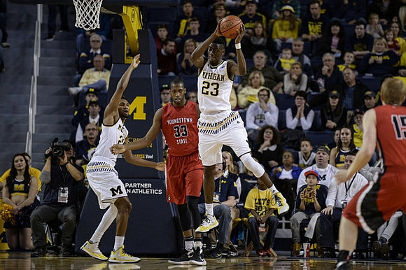 Zak Irvin (21) and Caris LeVert (23)