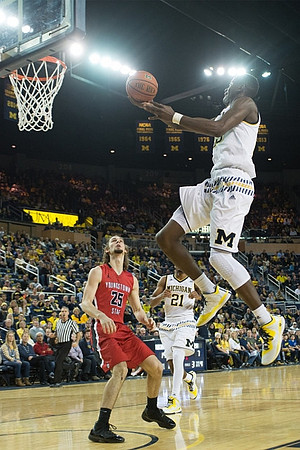 Zak Irvin (21) and Caris LeVert (23)