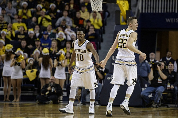 Derrick Walton Jr. (10) and Duncan Robinson (22)