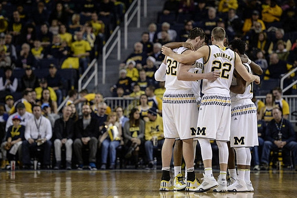 Ricky Doyle (32), Duncan Robinson (22), and Derrick Walton Jr. (10)