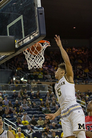 D.J. Wilson (5) and Moritz Wagner (13)