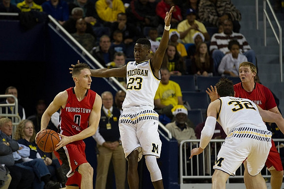 Caris LeVert (23) and Ricky Doyle (32)