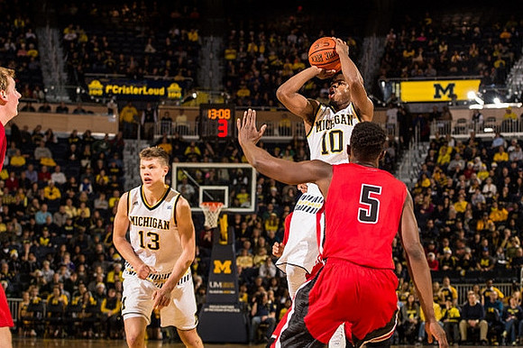 Moritz Wagner (13) and Derrick Walton Jr. (10)