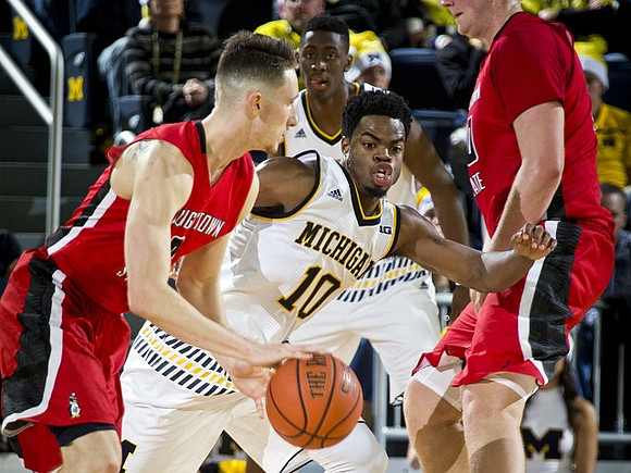 Derrick Walton Jr. (10) and Caris LeVert (23)