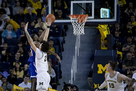 Brandon Johns Jr. (23) and Jon Teske (15)