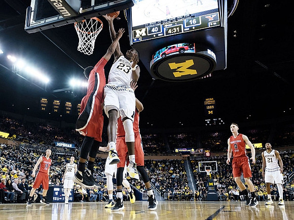 Duncan Robinson (22), Caris LeVert (23), and Zak Irvin (21)