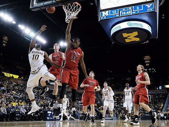 Derrick Walton Jr. (10), Duncan Robinson (22), Ricky Doyle (32), and Caris LeVert (23)