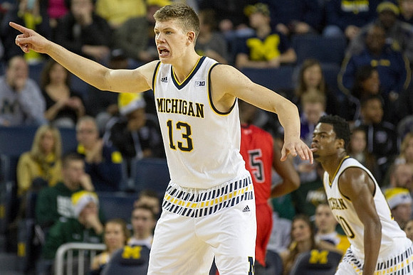 Moritz Wagner (13) and Derrick Walton Jr. (10)