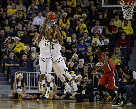 Caris LeVert (23) and Derrick Walton Jr. (10)