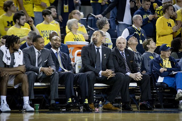 Zavier Simpson (3), Howard Eisley, Saddi Washington, Juwan Howard, and Phil Martelli