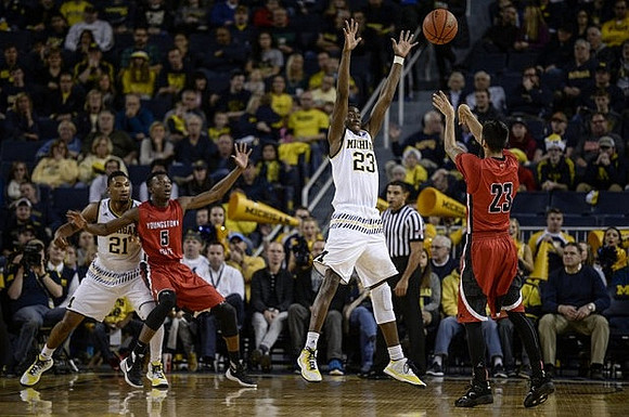 Zak Irvin (21) and Caris LeVert (23)