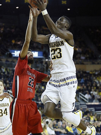 Mark Donnal (34) and Caris LeVert (23)