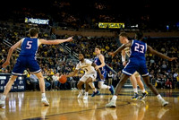 Zavier Simpson (3) and Jon Teske (15)