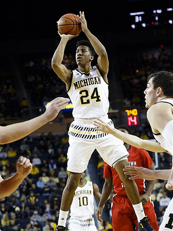 Aubrey Dawkins (24), Derrick Walton Jr. (10), and Ricky Doyle (32)