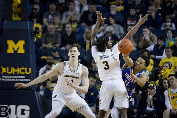 Colin Castleton (11) and Zavier Simpson (3)