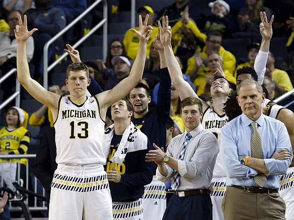 Moritz Wagner (13), Andrew Dakich (11), Spike Albrecht (2), Ricky Doyle (32), and John Beilein