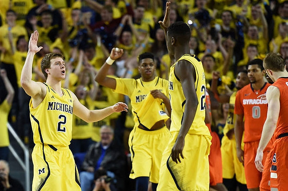 Spike Albrecht (2), Kameron Chatman (3), and Caris LeVert (23)
