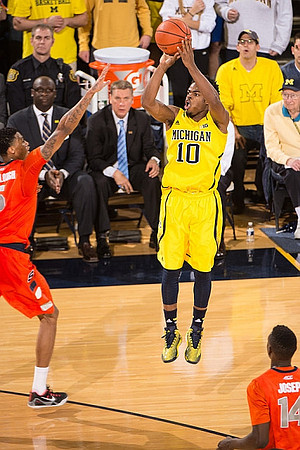 Derrick Walton Jr. (10), Bacari Alexander, and Jeff Meyer