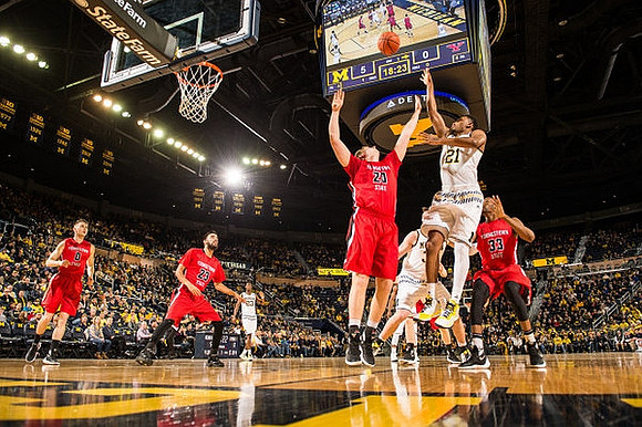 Zak Irvin (21) and Caris LeVert (23)