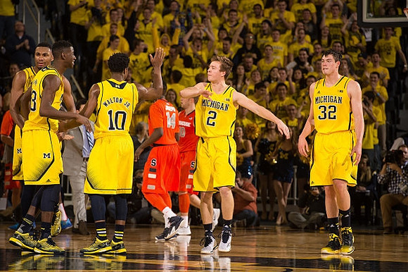 Zak Irvin (21), Caris LeVert (23), Derrick Walton Jr. (10), Spike Albrecht (2), and Ricky Doyle (32)