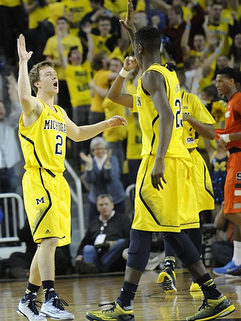 Spike Albrecht (2) and Caris LeVert (23)