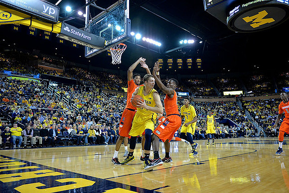 Mark Donnal (34), Kameron Chatman (3), and Caris LeVert (23)