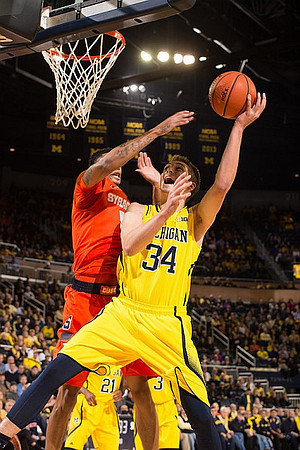 Mark Donnal (34), Zak Irvin (21), and Kameron Chatman (3)