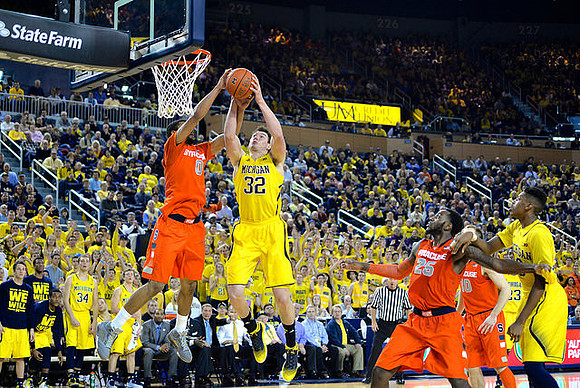 Ricky Doyle (32), Caris LeVert (23), and Kameron Chatman (3)