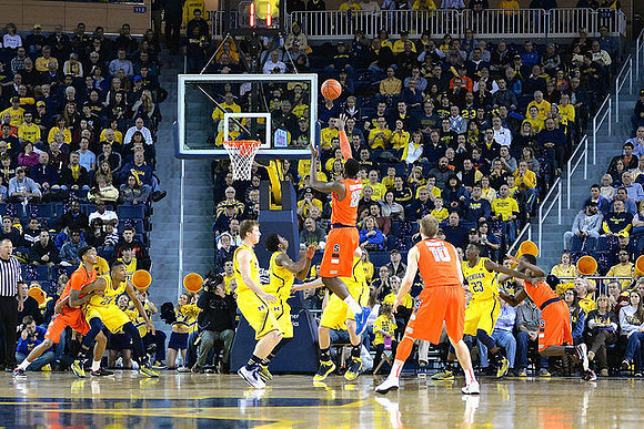 Zak Irvin (21), Spike Albrecht (2), Derrick Walton Jr. (10), and Caris LeVert (23)