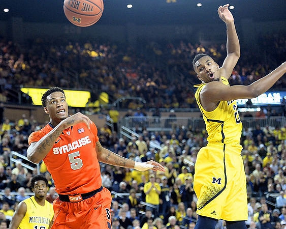 Derrick Walton Jr. (10) and Zak Irvin (21)